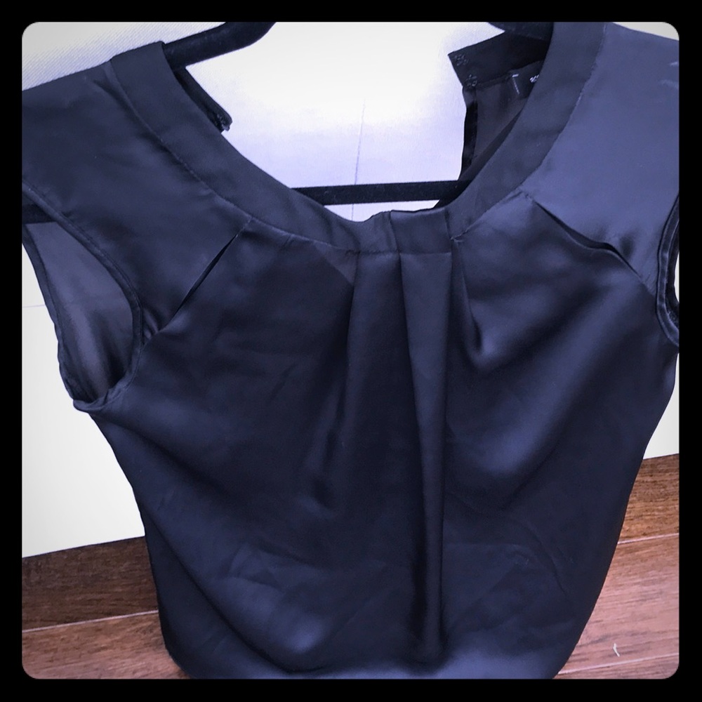 Silky black top. In excellent condition.